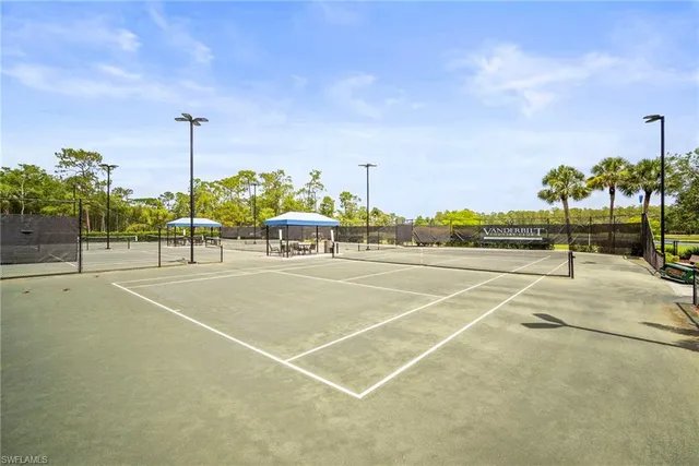 a tennis court with lamp