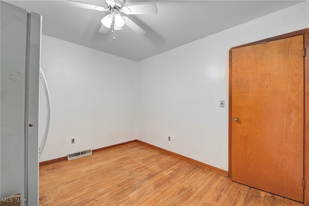 1140 West River Road Vermilion, OH 44089 - Photo 20 of 49 Unfurnished room featuring light wood-type flooring and ceiling fan