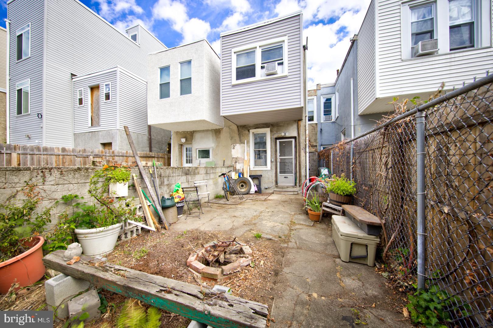 2044 Tasker Street Philadelphia, PA 19145 - Photo 12 of 15 a view of a backyard with sitting area and furniture
