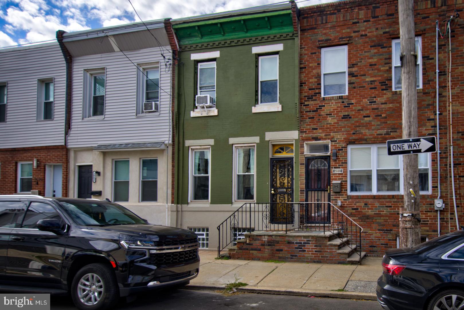 2044 Tasker Street Philadelphia, PA 19145 - Photo 13 of 15 a car parked in front of a building