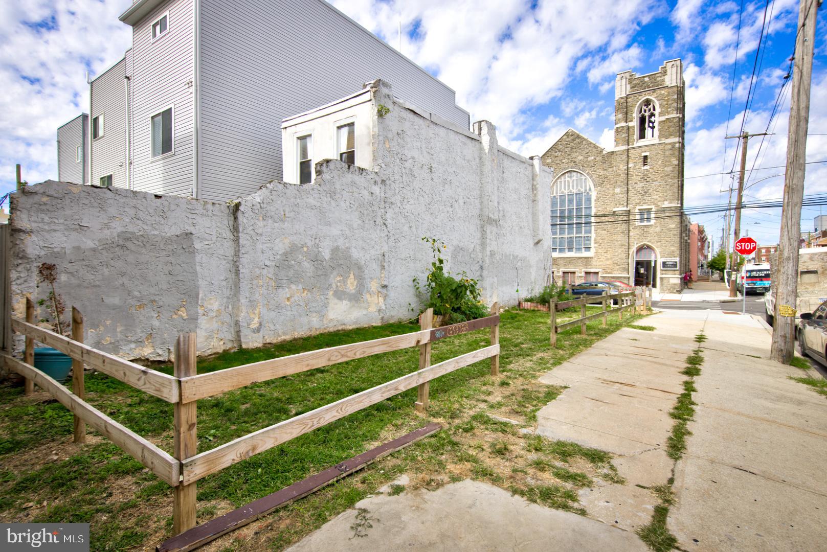 2044 Tasker Street Philadelphia, PA 19145 - Photo 14 of 15 a view of a building with many windows