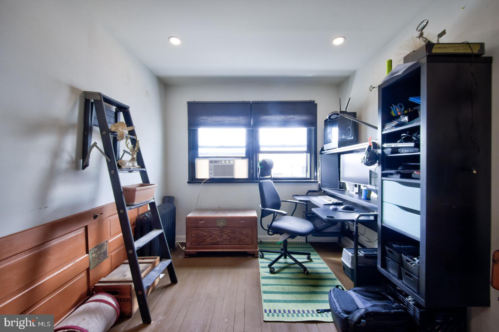 2044 Tasker Street Philadelphia, PA 19145 - Photo 6 of 15 a workspace with furniture staircase and a window
