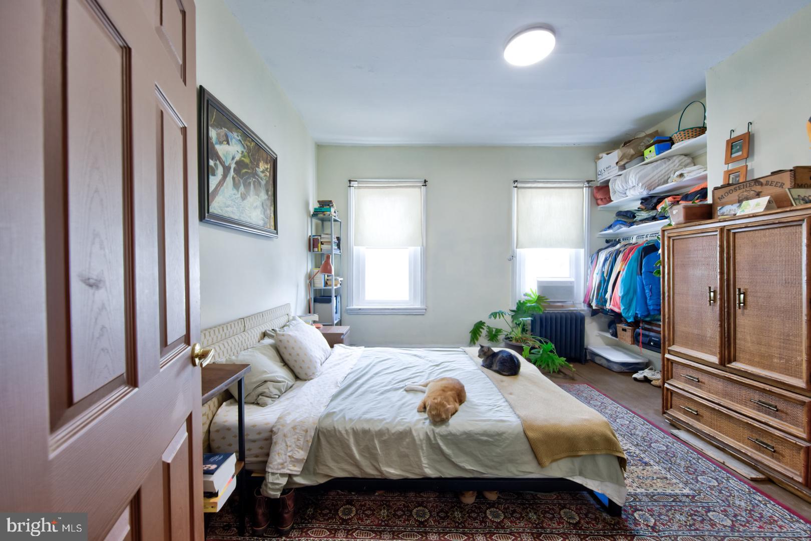 2044 Tasker Street Philadelphia, PA 19145 - Photo 10 of 15 a bedroom with a bed and a window