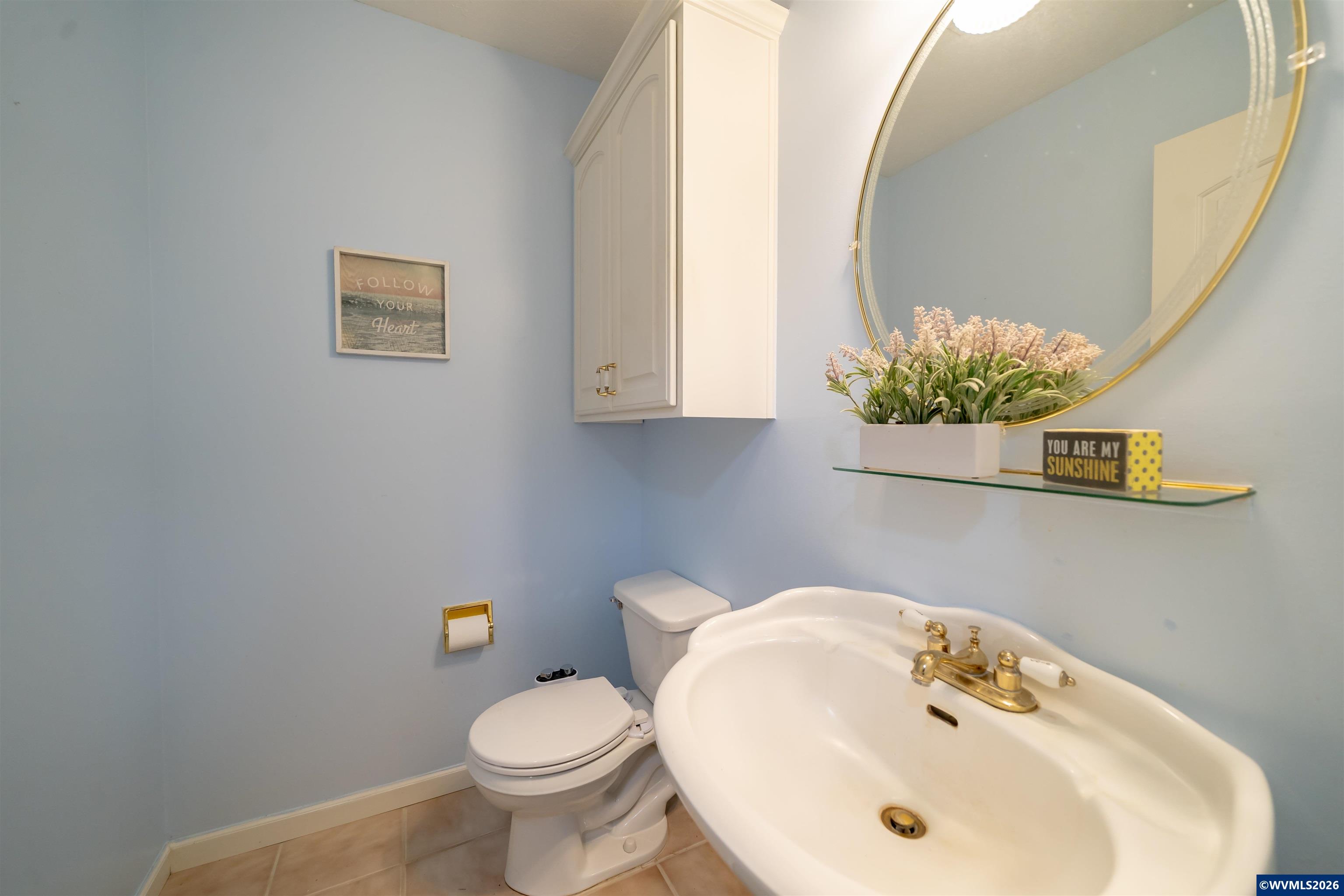 312 Southwest Cascade Meadow Drive Sublimity, OR 97385 - Photo 28 of 42 a bathroom with a sink and a toilet
