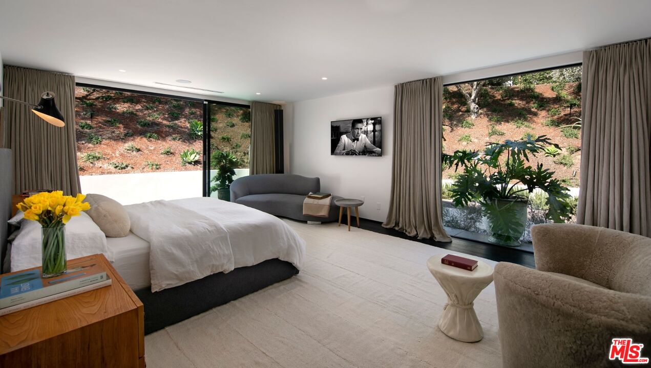 1731 Rising Glen Road Los Angeles, CA 90069 - Photo 11 of 27 a living room with furniture and a large window