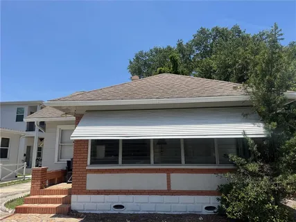 a view of house with outdoor space and porch