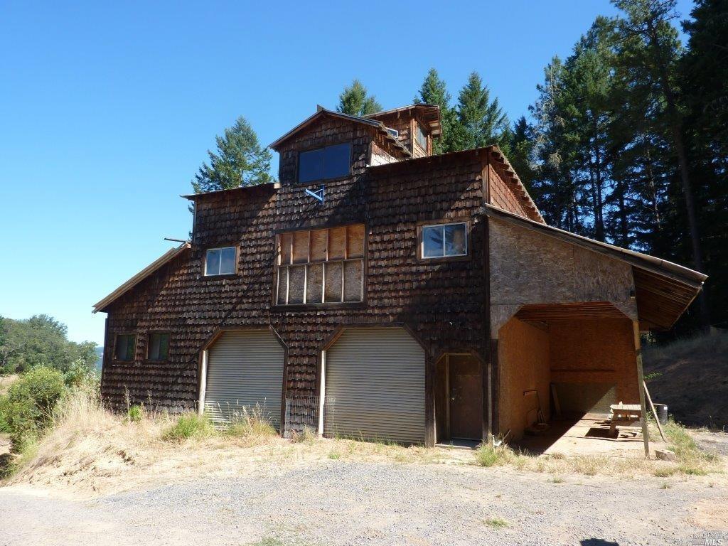 23301 Eastside Road Willits, CA 95490 - Photo 1 of 1 a front view of a house with a yard