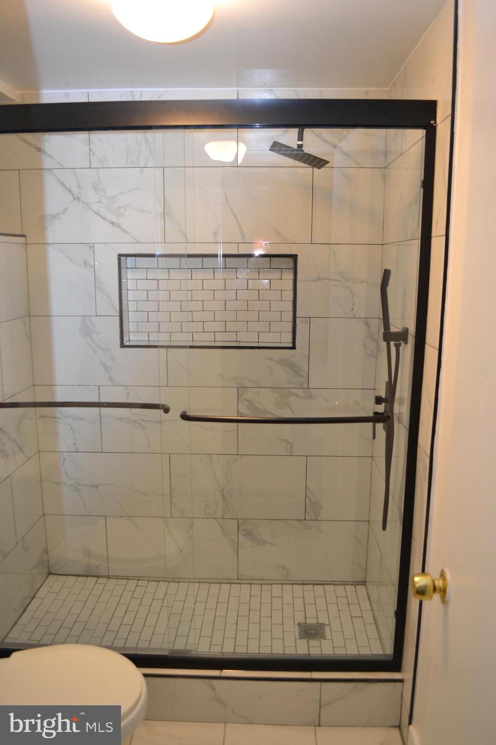 5153 Frederick Avenue Baltimore, MD 21229 - Photo 20 of 29 a bathroom with a shower