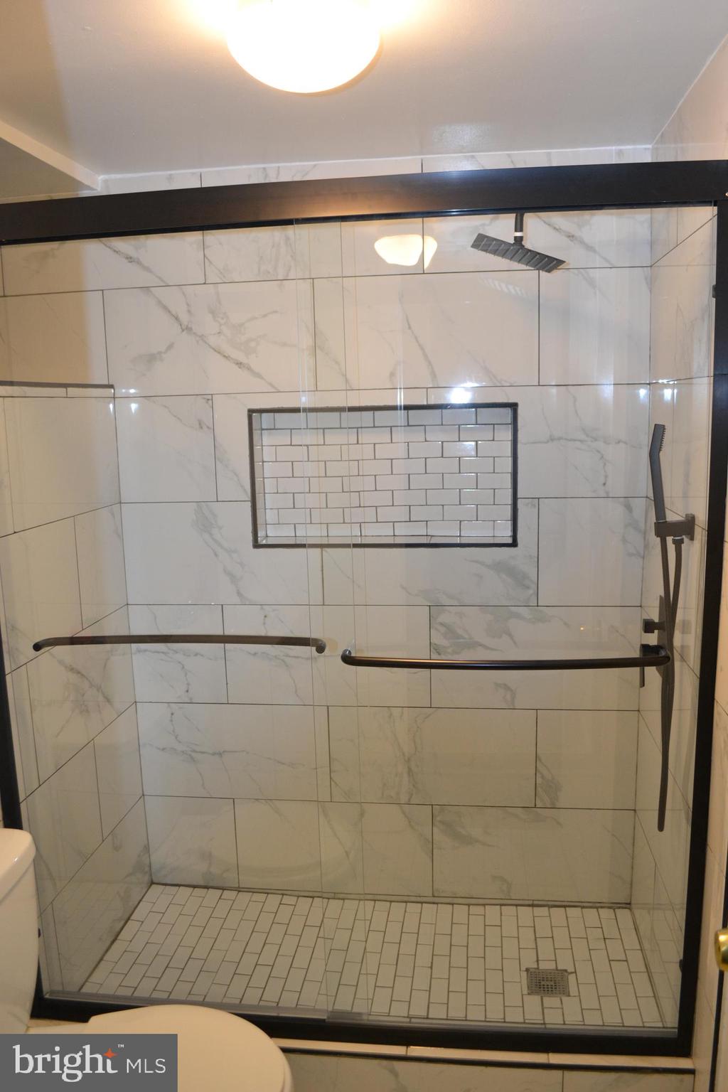 5153 Frederick Avenue Baltimore, MD 21229 - Photo 21 of 29 a bathroom with a shower