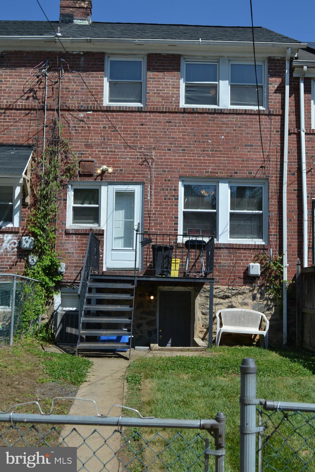 5153 Frederick Avenue Baltimore, MD 21229 - Photo 25 of 29 a front view of a house with a yard