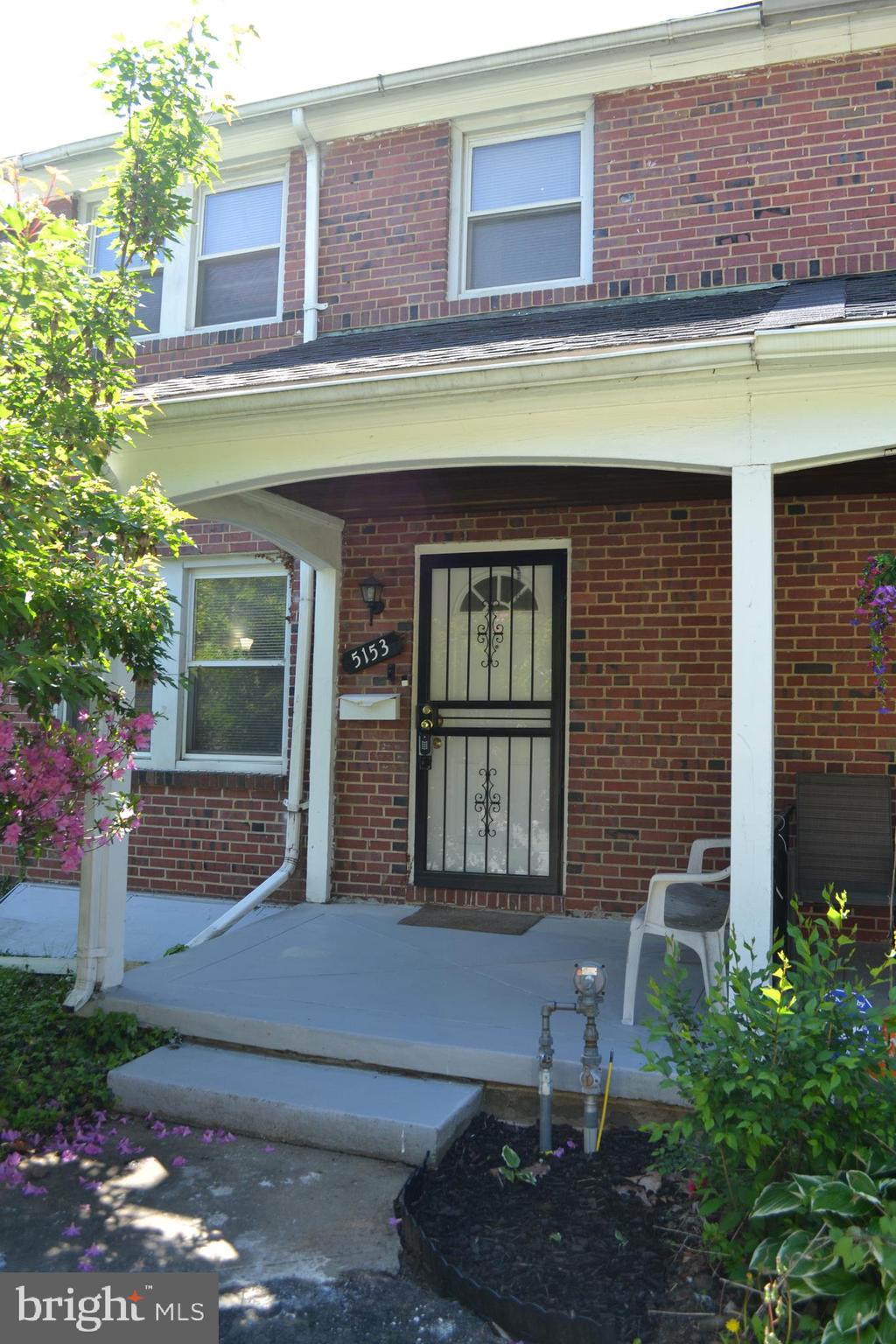 5153 Frederick Avenue Baltimore, MD 21229 - Photo 3 of 29 a front view of a house with garden