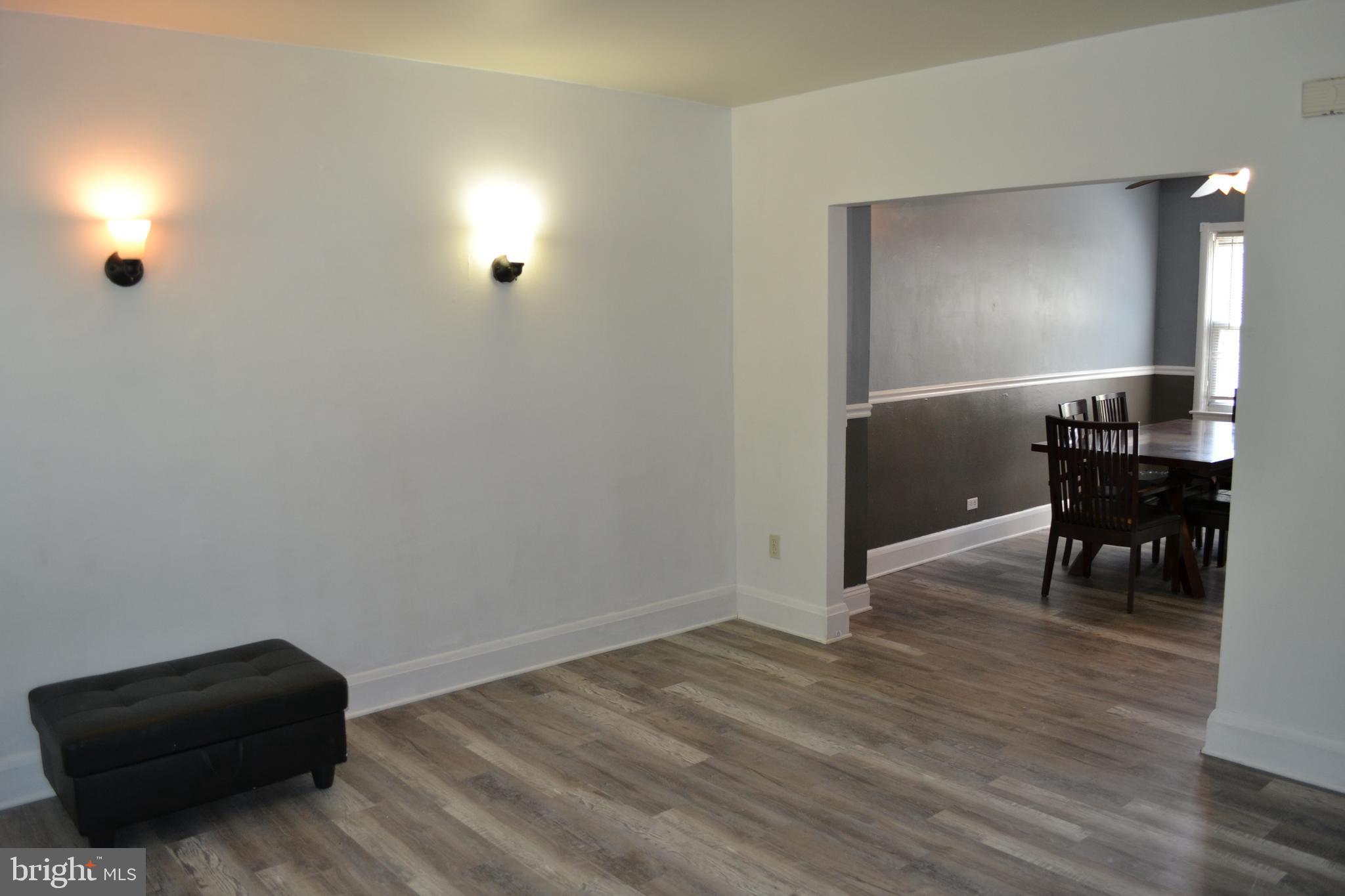 5153 Frederick Avenue Baltimore, MD 21229 - Photo 4 of 29 a view of a livingroom with furniture and a workspace