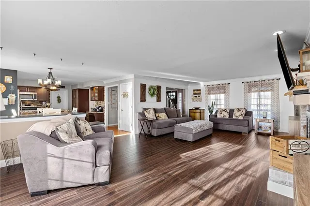 a living room with furniture or couch and a wooden floor