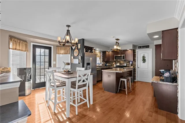 a view of a dining room with furniture window and outside view
