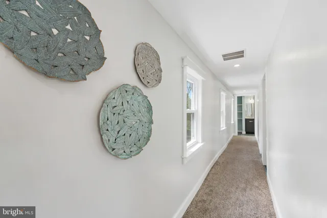 a view of a hallway with entryway