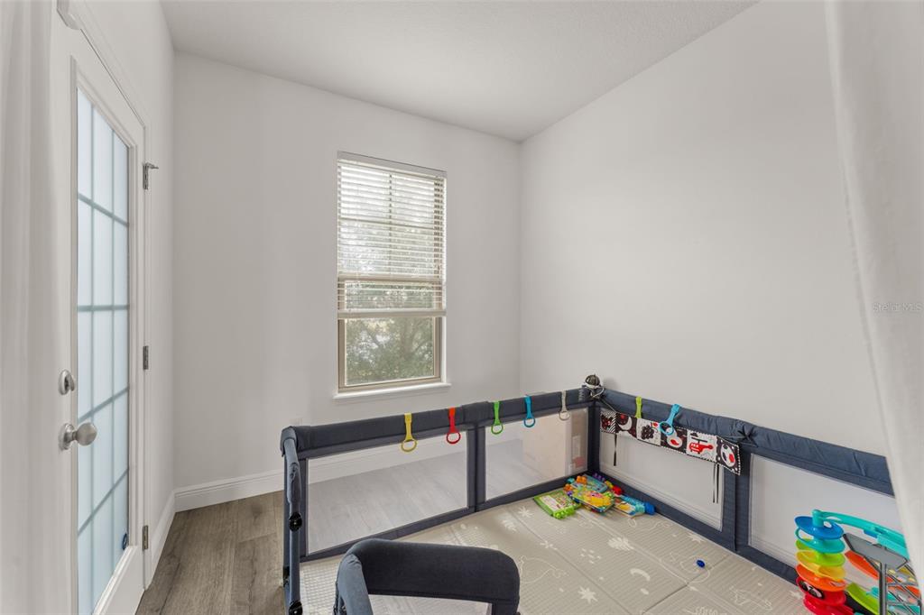 10814 Sunset Ridge Lane Orlando, FL 32832 - Photo 20 of 42 a room with furniture and a window