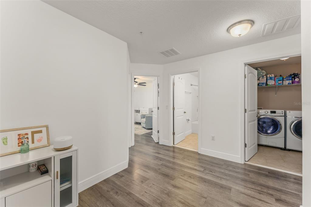 10814 Sunset Ridge Lane Orlando, FL 32832 - Photo 23 of 42 a view of a storage & utility room with wooden floor