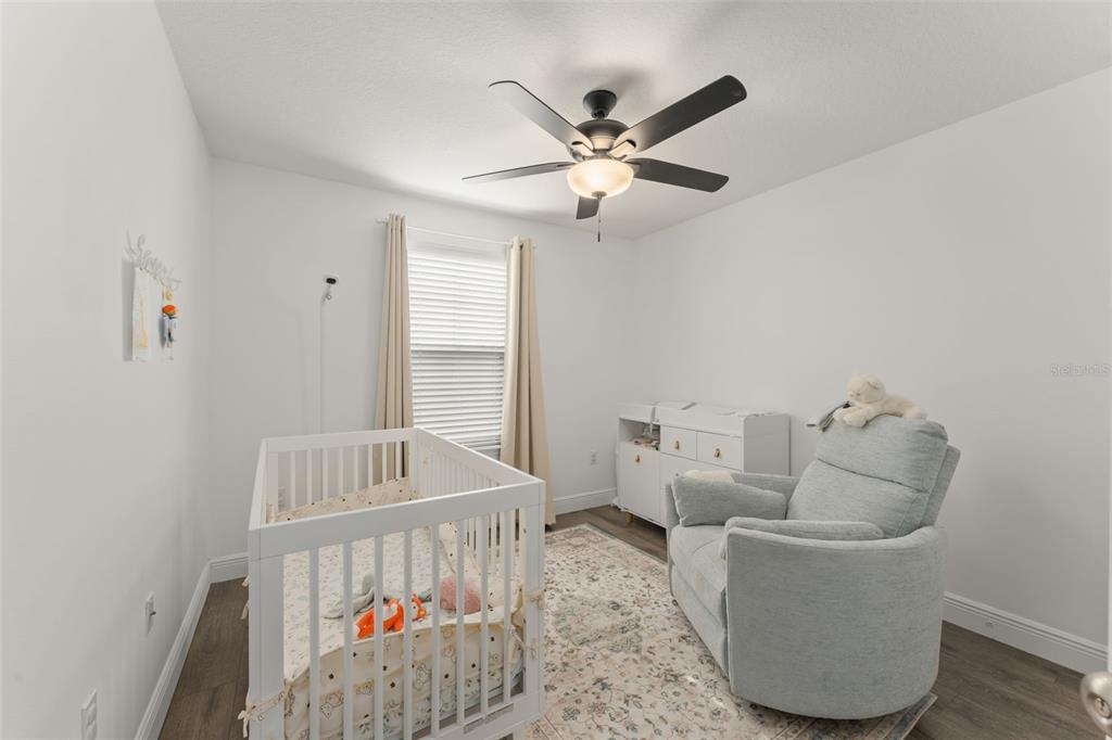 10814 Sunset Ridge Lane Orlando, FL 32832 - Photo 28 of 42 a living room with furniture and a window