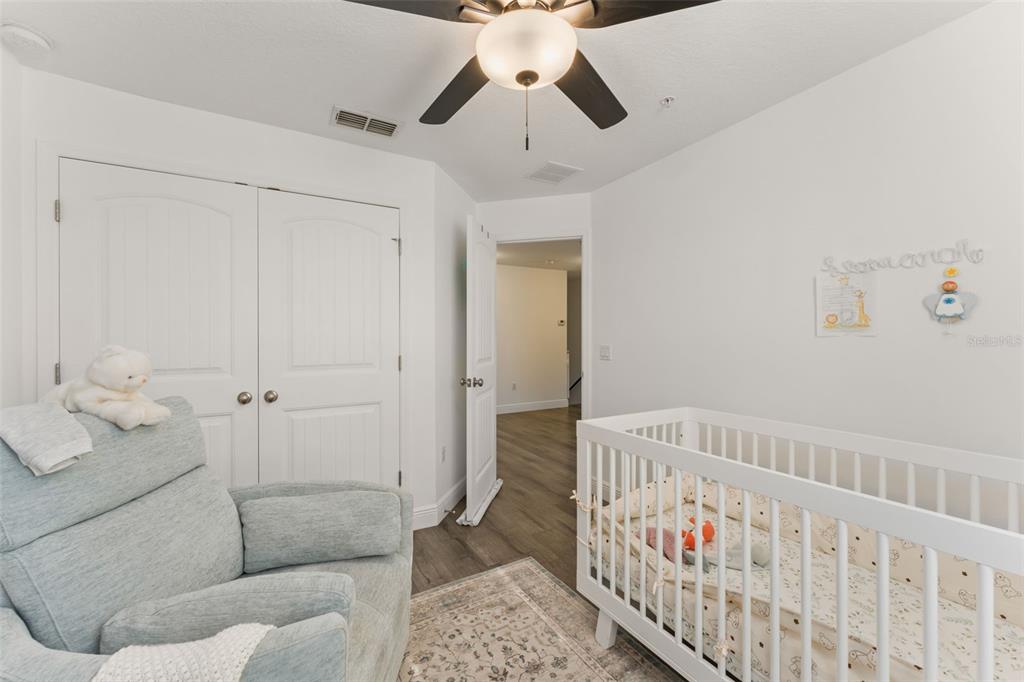 10814 Sunset Ridge Lane Orlando, FL 32832 - Photo 29 of 42 a bedroom with furniture and wooden floor