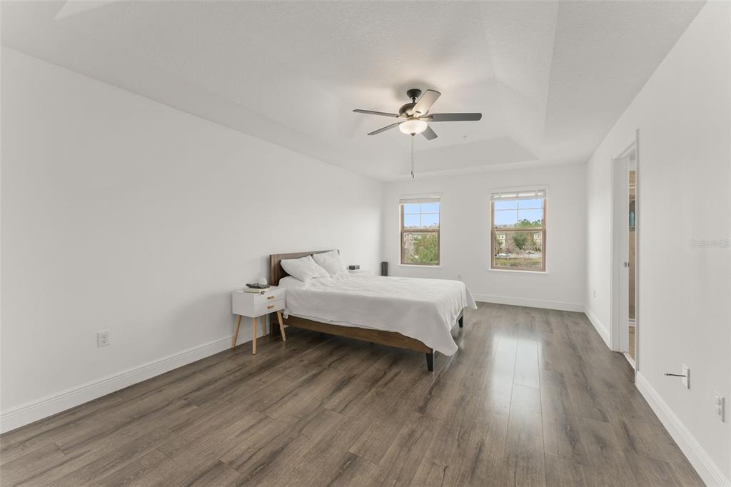 10814 Sunset Ridge Lane Orlando, FL 32832 - Photo 30 of 42 a spacious bedroom with a bed and a window