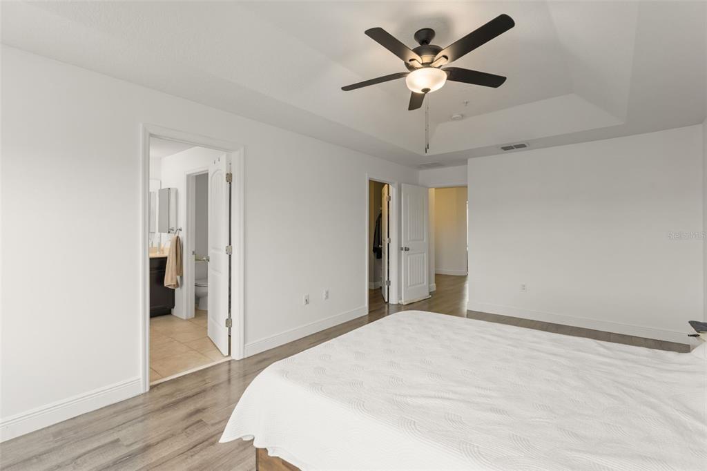 10814 Sunset Ridge Lane Orlando, FL 32832 - Photo 33 of 42 a bedroom with a bed and a ceiling fan