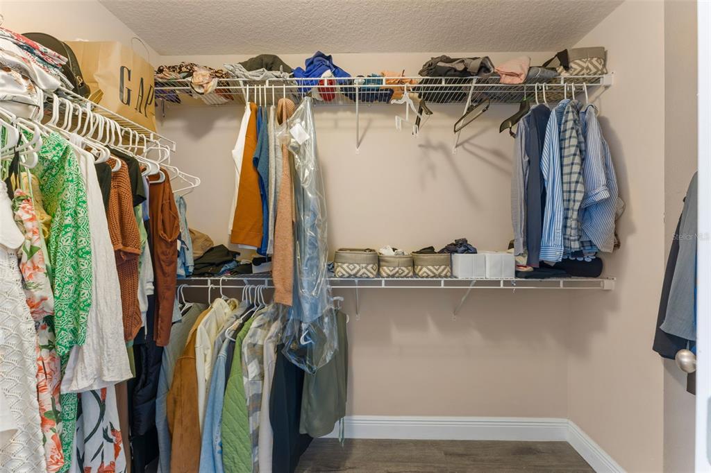 10814 Sunset Ridge Lane Orlando, FL 32832 - Photo 36 of 42 a view of walk in closet with clothes and shoes