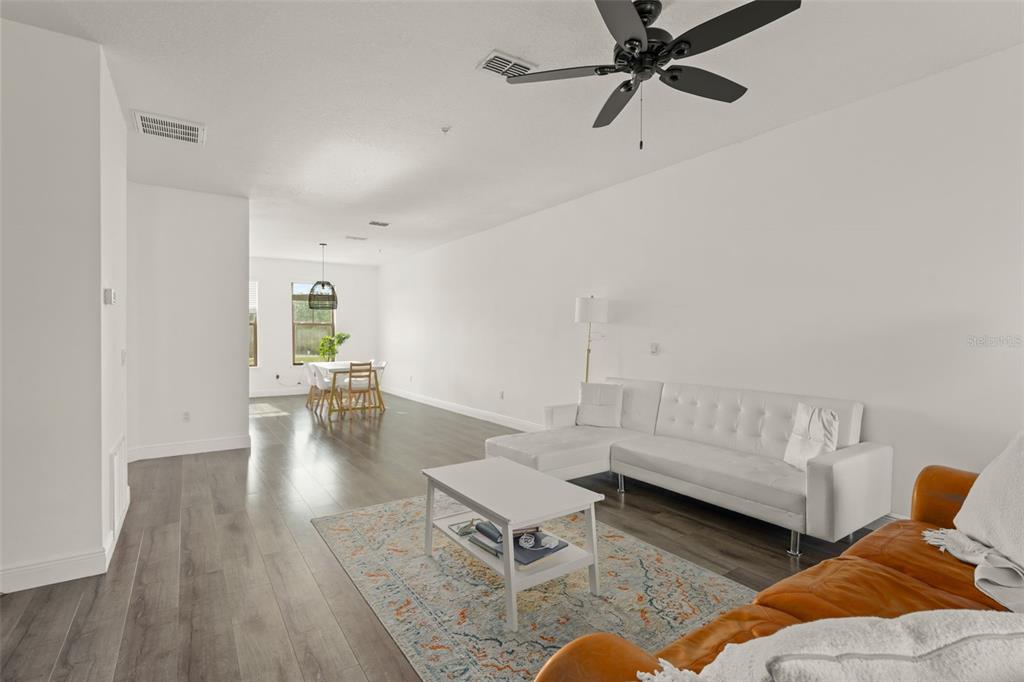 10814 Sunset Ridge Lane Orlando, FL 32832 - Photo 9 of 42 a living room with furniture and wooden floor