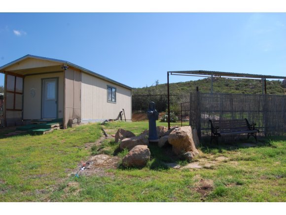 1340 Running Springs Road Dewey, AZ 86327 - Photo 3 of 20 a backyard of a house with table and chairs