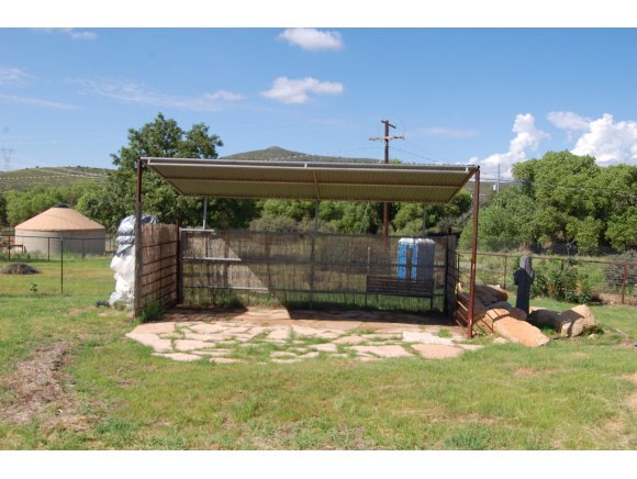 1340 Running Springs Road Dewey, AZ 86327 - Photo 4 of 20 a backyard of a house with table and chairs