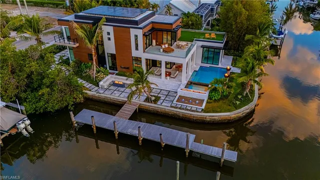 a view of an outdoor sitting area with brick walls