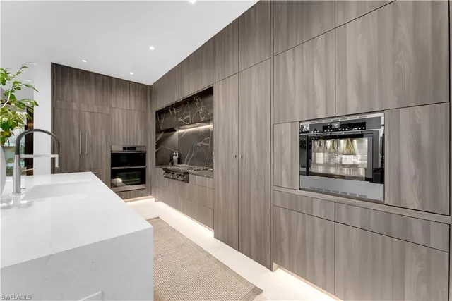 a kitchen with stainless steel appliances a refrigerator and a sink