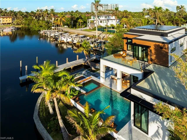 an aerial view of a house with a lake view