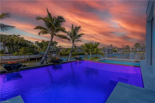 a view of swimming pool with outdoor seating