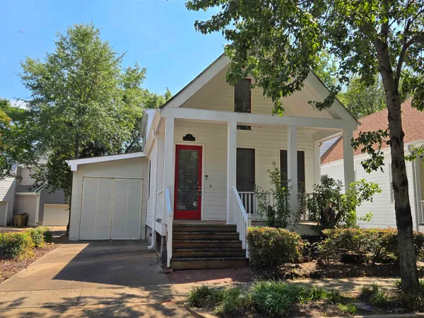 a view of wooden floor fire place and windows in an empty room