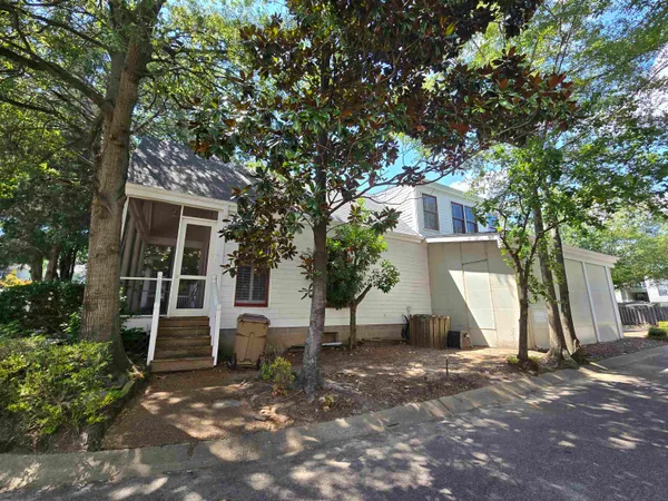 a kitchen with stainless steel appliances granite countertop a refrigerator a stove and a wooden floors