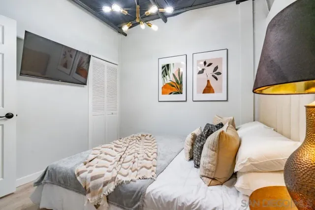 a bathroom with a toilet and a shower curtain