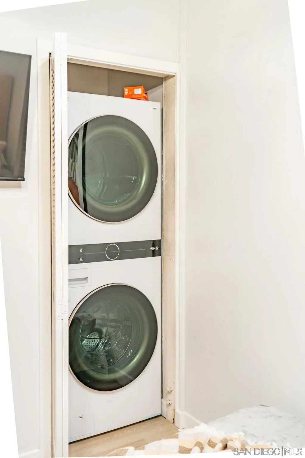 1298 Prospect Street, Unit 2F La Jolla, CA 92037 - Photo 24 of 54 a close up view of a washer and dryer