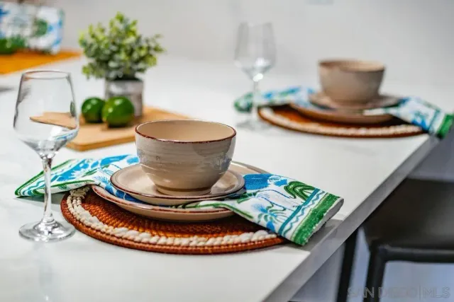 a kitchen with a potted plant on the wall and a potted plant
