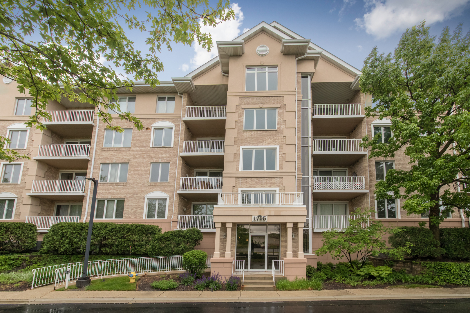 1705 Pavilion Way, Unit 401 Park Ridge, IL 60068 - Photo 1 of 2 a front view of a building with street view