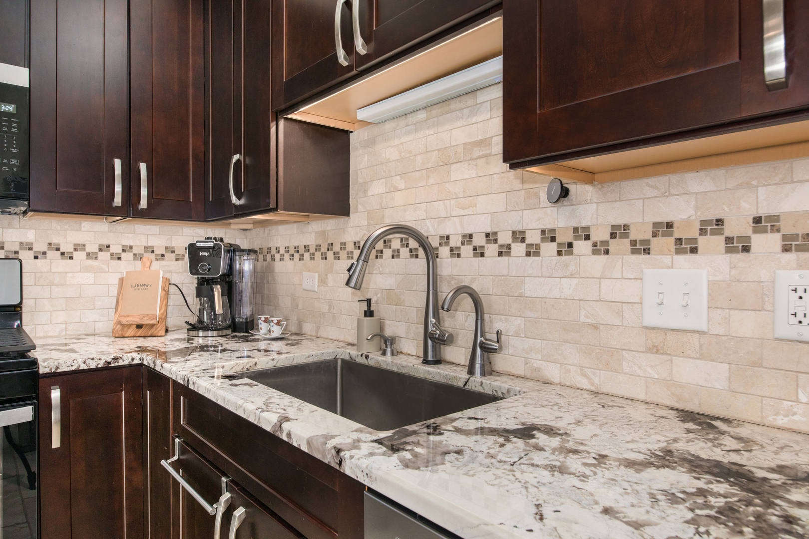 1705 Pavilion Way, Unit 401 Park Ridge, IL 60068 - Photo 12 of 25 a kitchen with a sink and a stove top oven