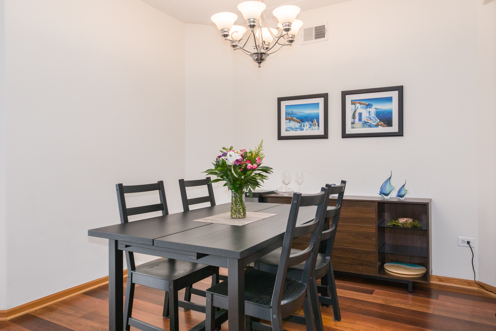 1705 Pavilion Way, Unit 401 Park Ridge, IL 60068 - Photo 13 of 25 a view of a dining room with furniture and wooden floor