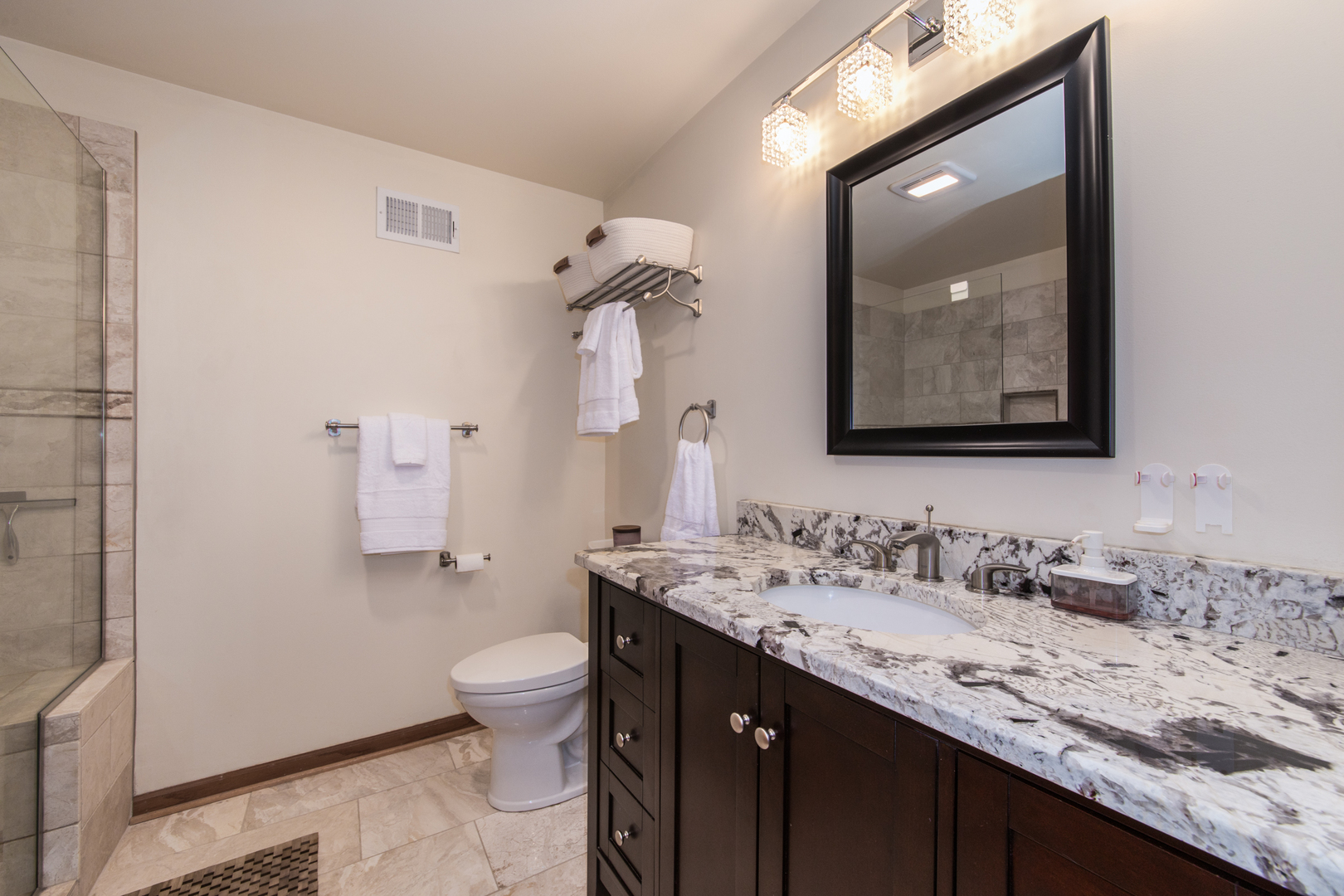 1705 Pavilion Way, Unit 401 Park Ridge, IL 60068 - Photo 18 of 25 a bathroom with a granite countertop sink mirror and toilet