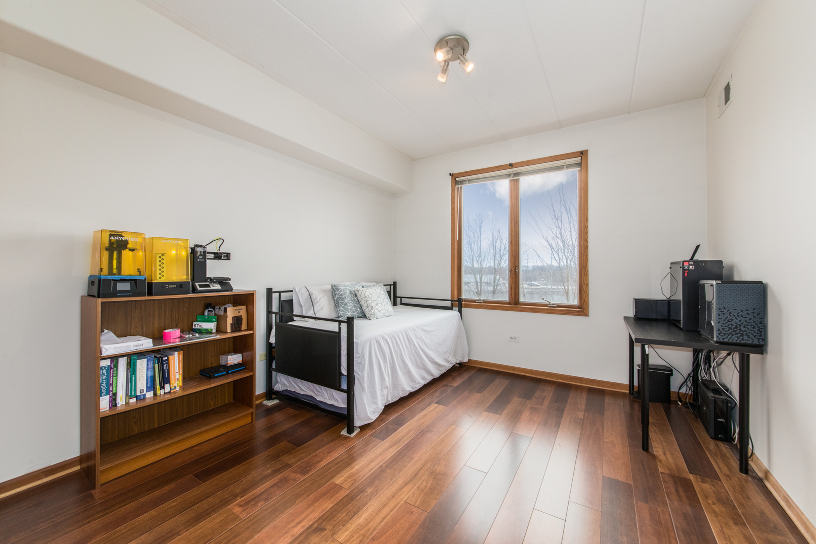 1705 Pavilion Way, Unit 401 Park Ridge, IL 60068 - Photo 20 of 25 a bedroom with furniture and a wooden floor