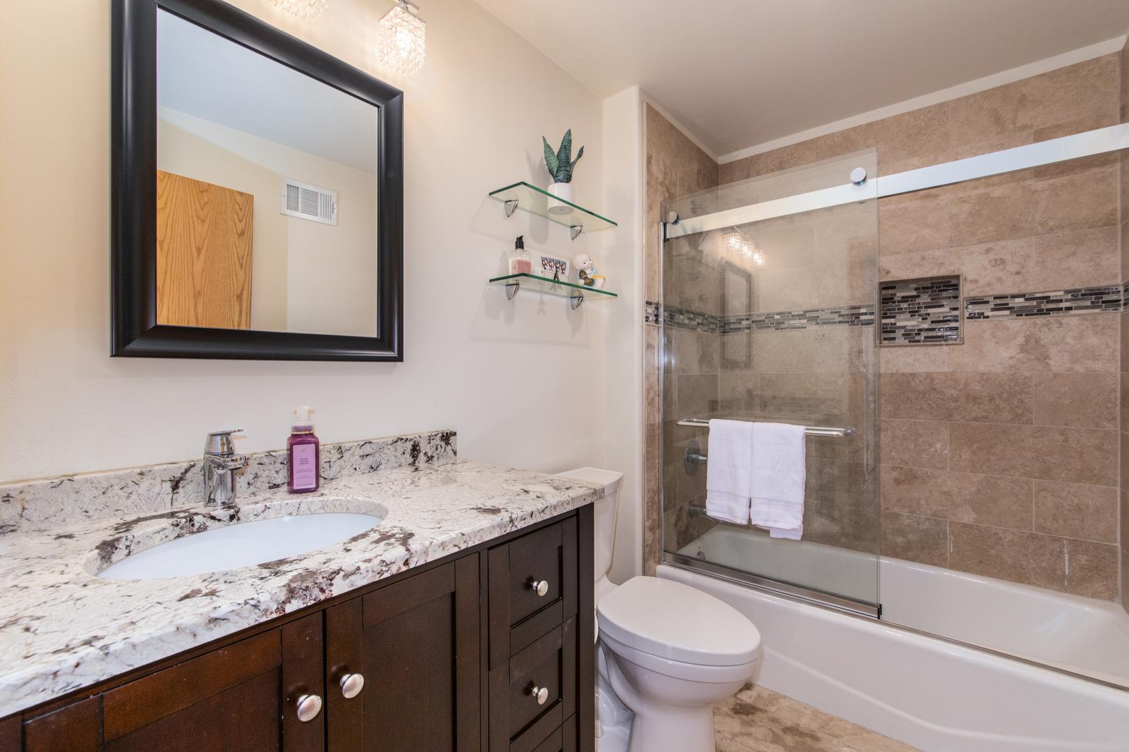 1705 Pavilion Way, Unit 401 Park Ridge, IL 60068 - Photo 22 of 25 a bathroom with a granite countertop sink toilet and shower