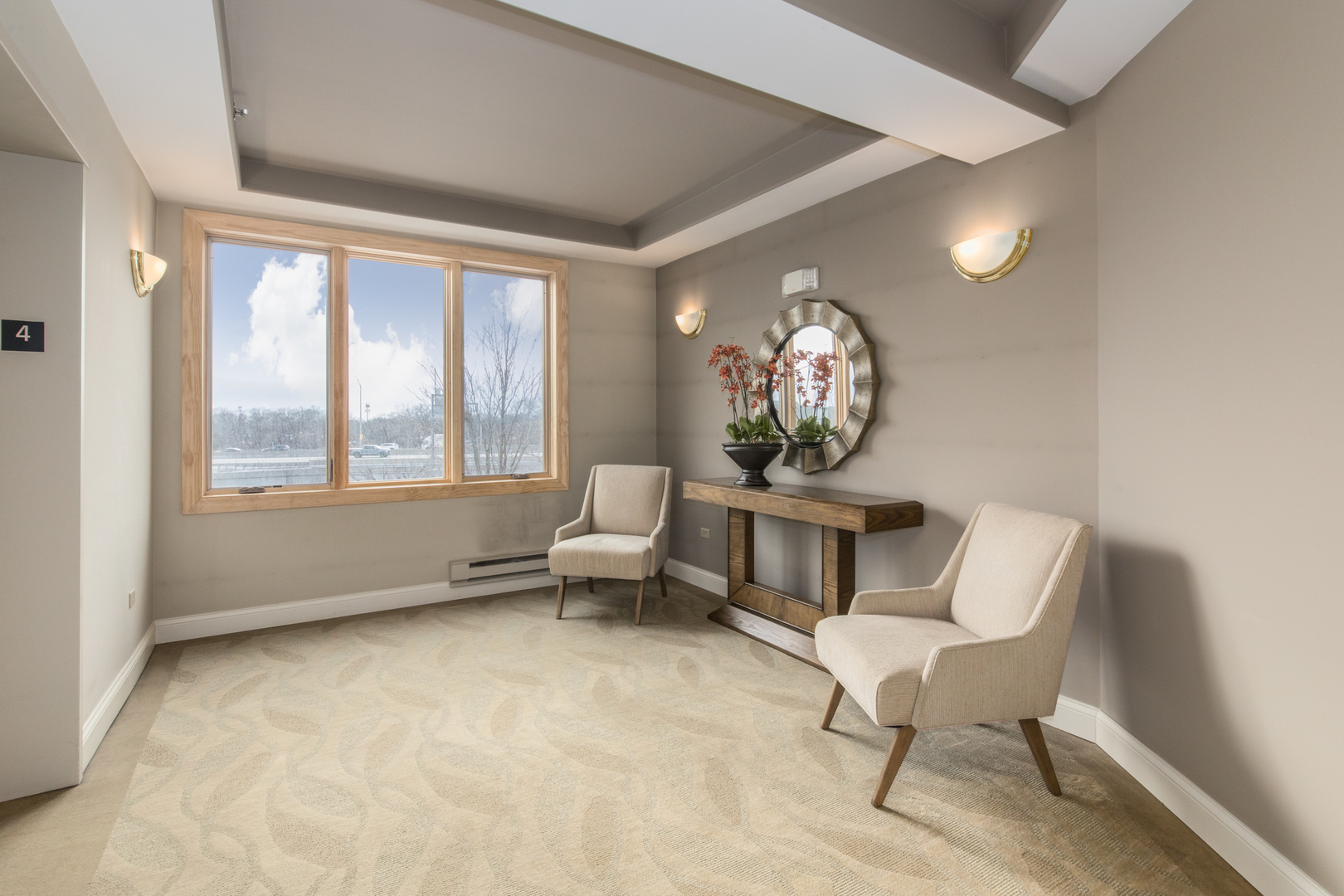 1705 Pavilion Way, Unit 401 Park Ridge, IL 60068 - Photo 3 of 25 a living room with furniture and a large window