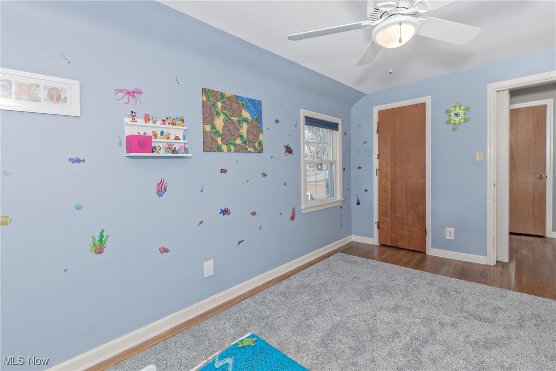 5263 Edenhurst Road Cleveland, OH 44124 - Photo 25 of 38 Bedroom #2 with ceiling fan and hardwood flooring.
