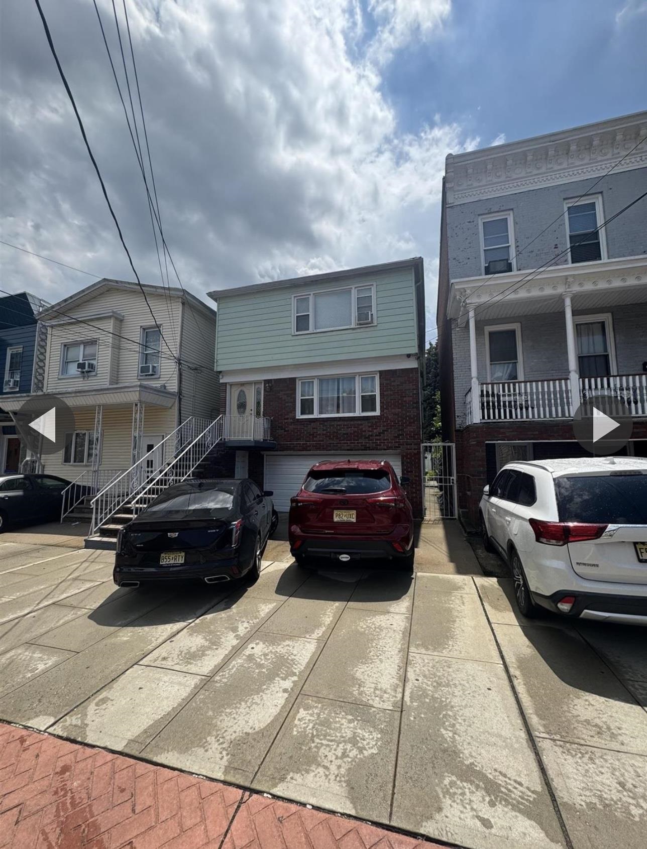 315 22nd Street Union City, NJ 07087 - Photo 2 of 11 a car parked in front of a building