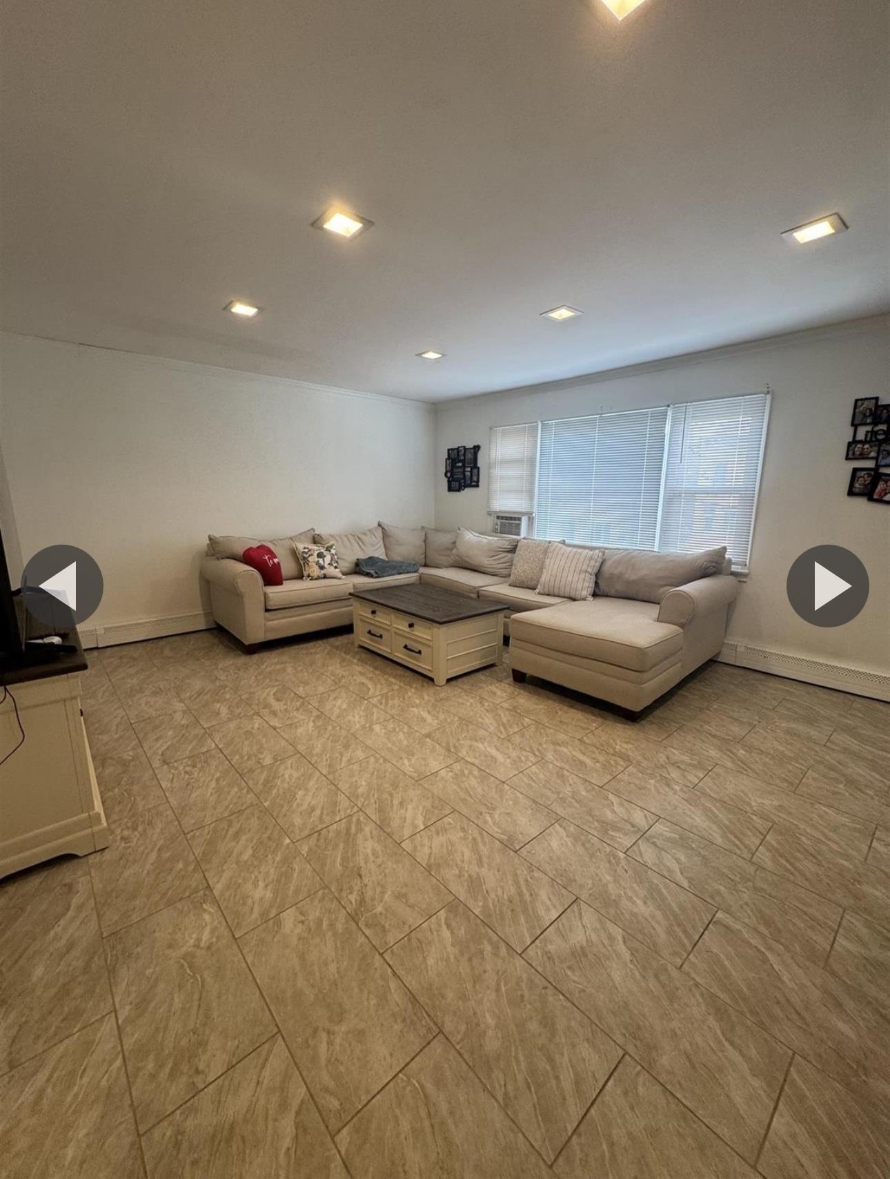 315 22nd Street Union City, NJ 07087 - Photo 3 of 11 a living room with furniture and a wooden floor