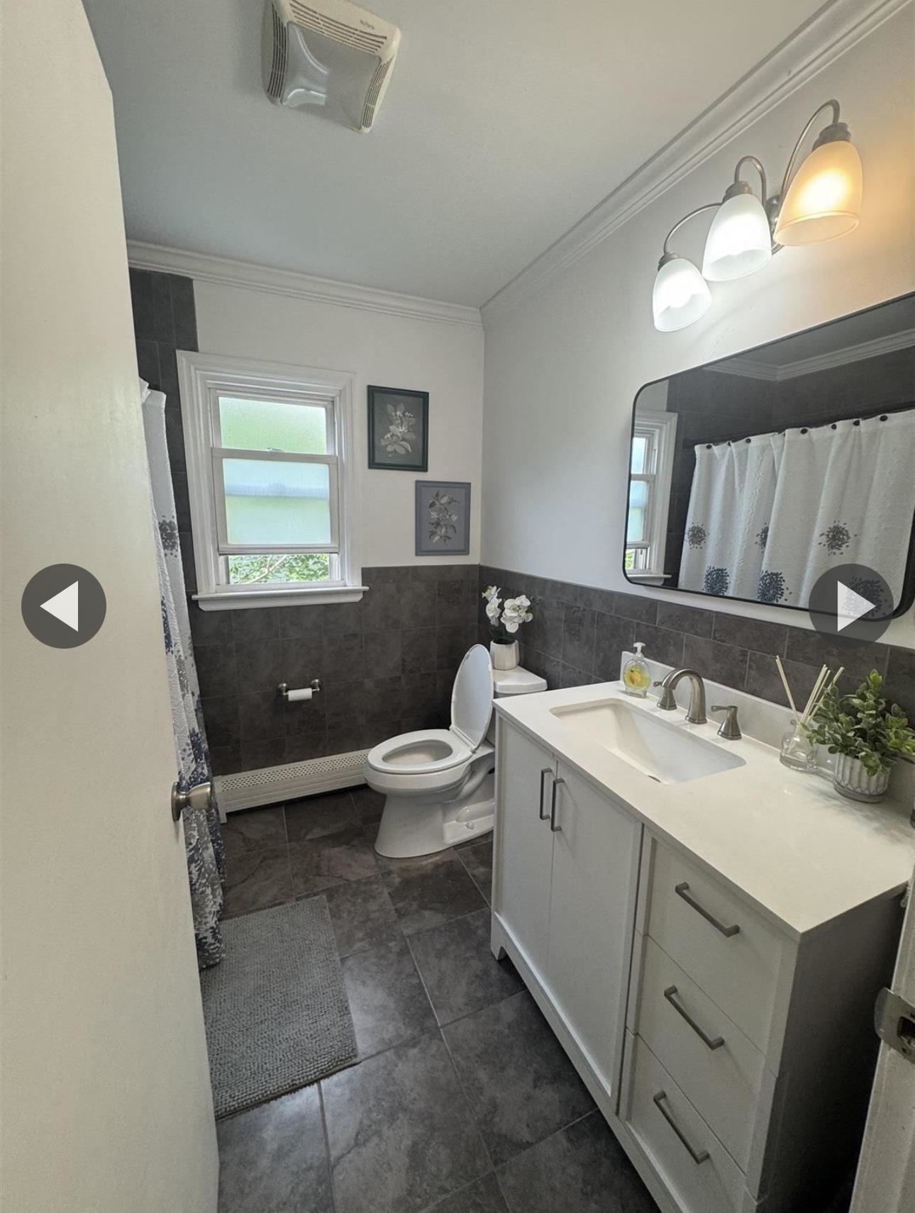 315 22nd Street Union City, NJ 07087 - Photo 5 of 11 a view of bathroom with a sink mirror and toilet