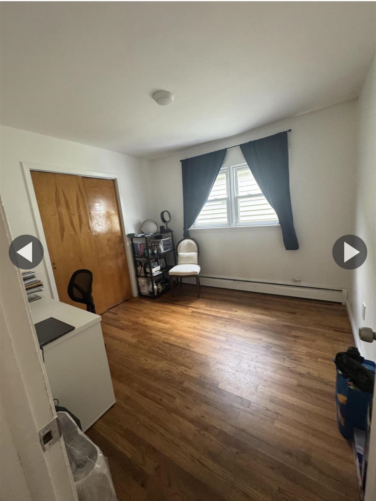315 22nd Street Union City, NJ 07087 - Photo 7 of 11 a room with furniture and a window